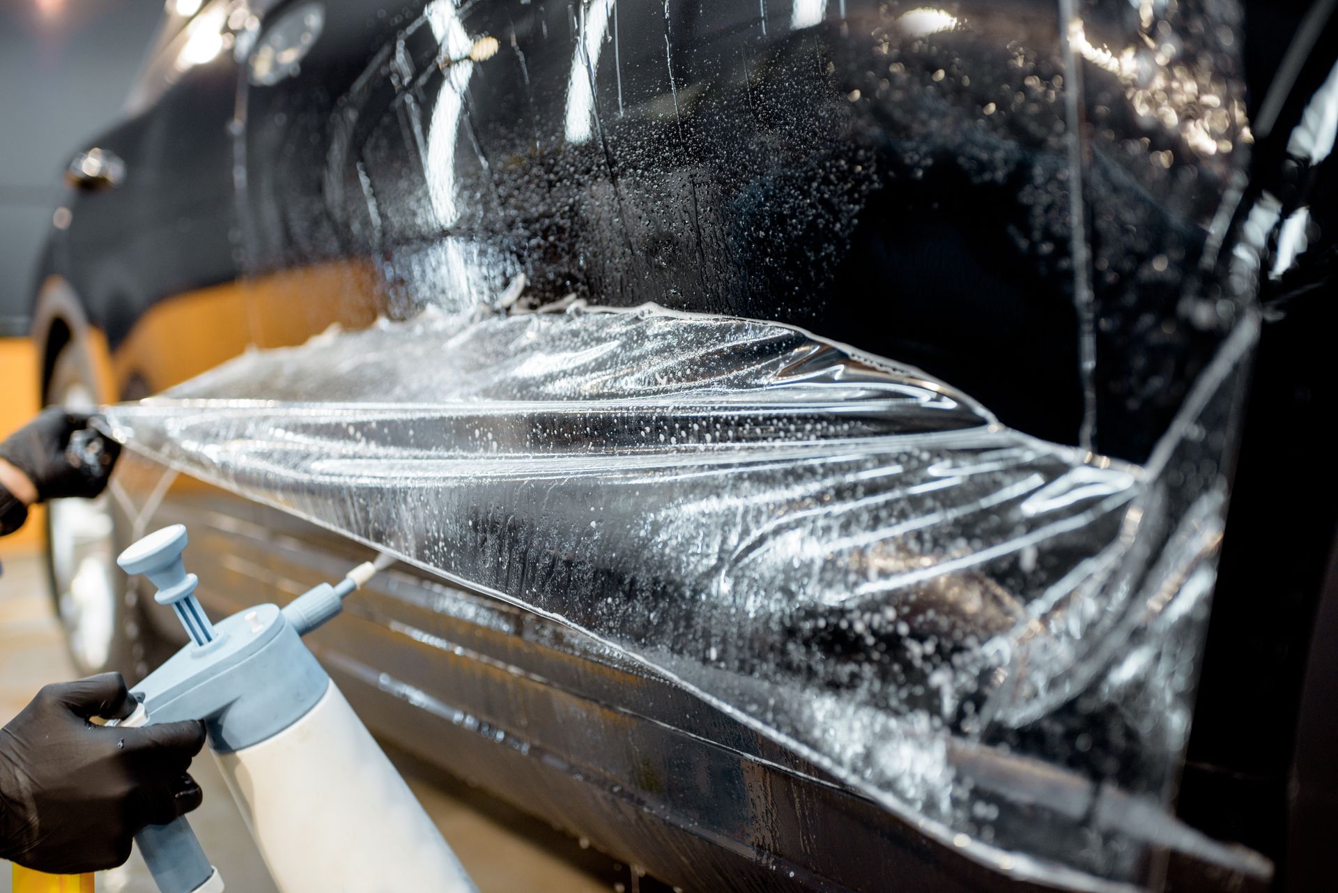 Paint protection film PPF installation on car hood